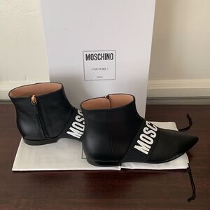 Moschino Women’s logo print top grain leather upper/ lining ankle bootie Sz 6; 7